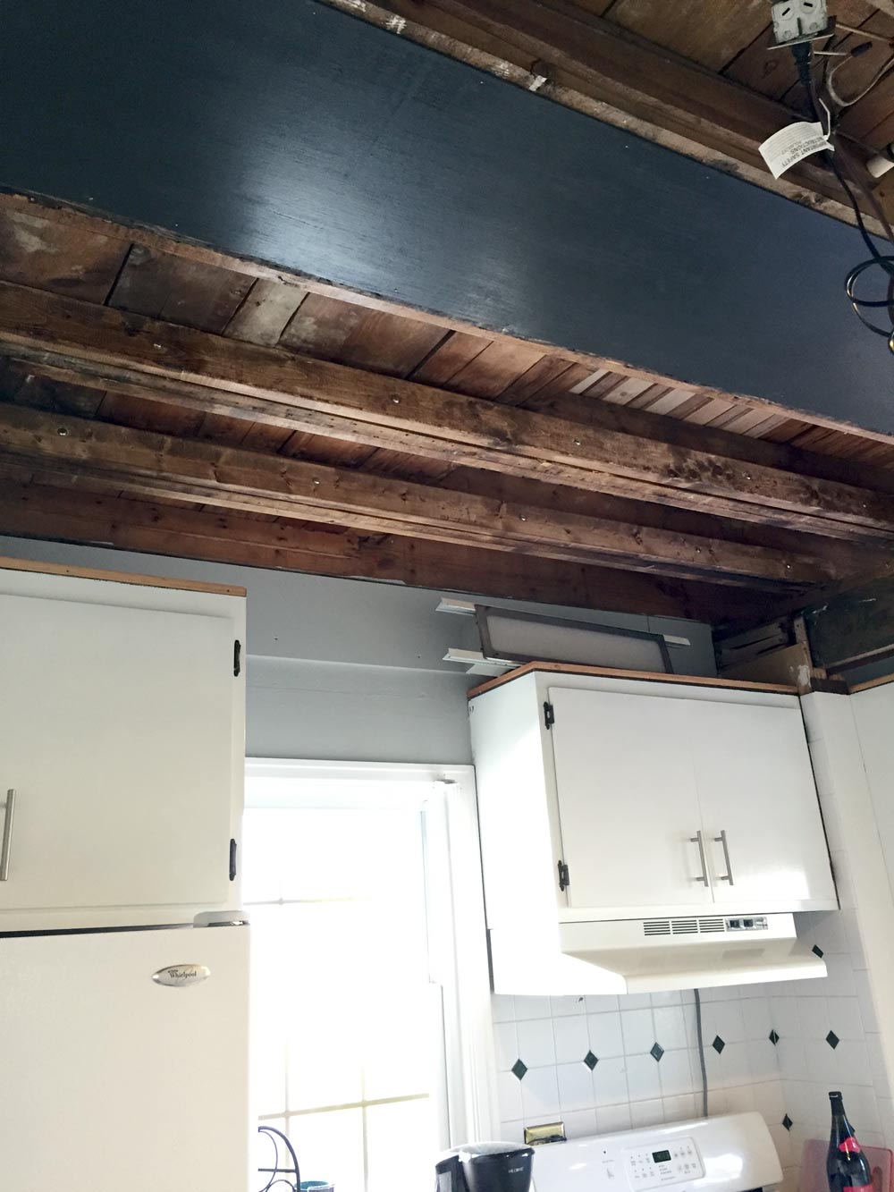 Kitchen ceiling sister joists stained to match rafters