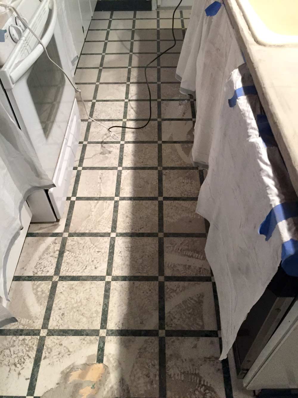 sanding DIY feather finish concrete over tile counters is MESSY
